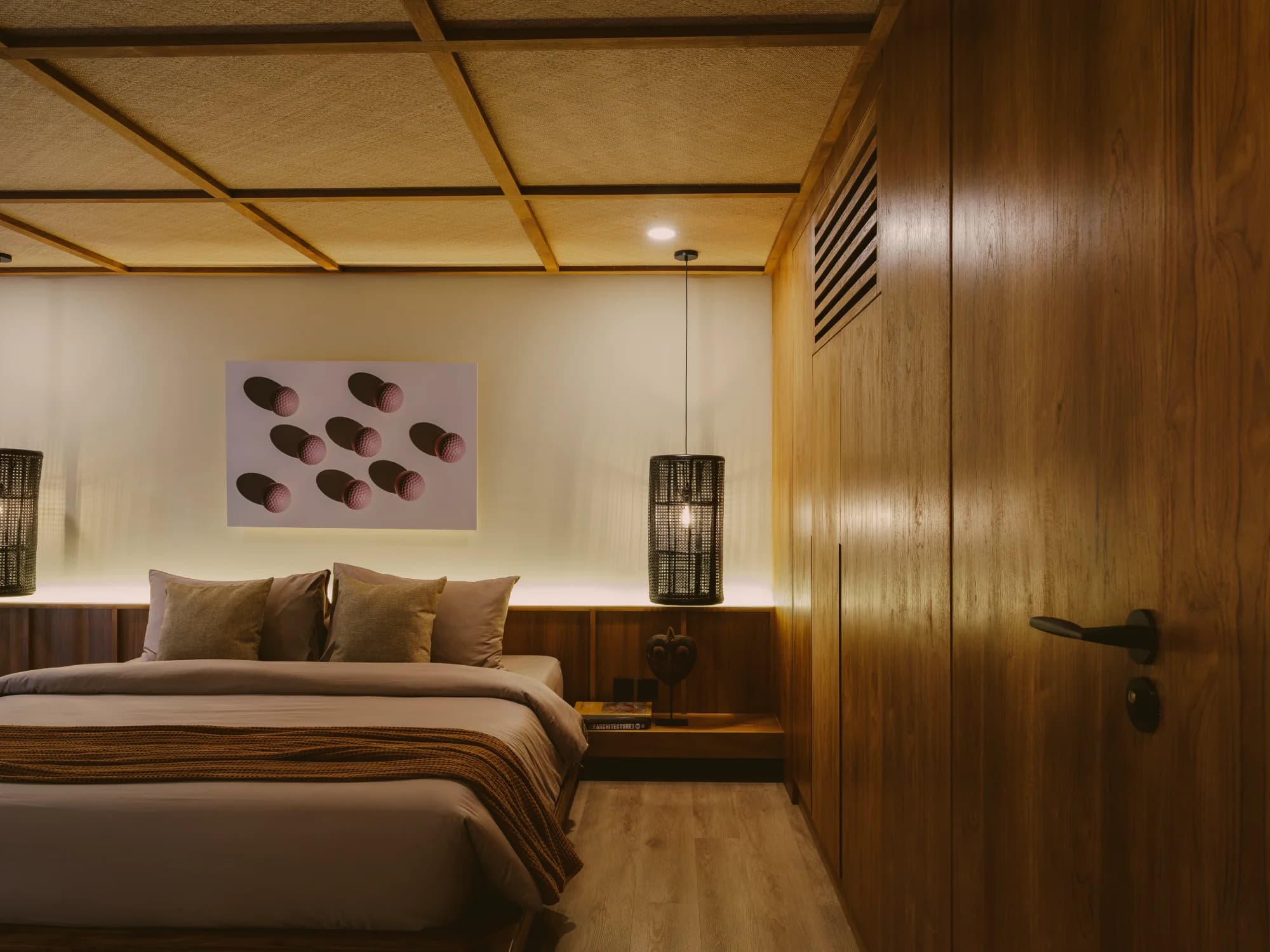 Deluxe mezzanine bedroom suite with king bed and timber ceiling