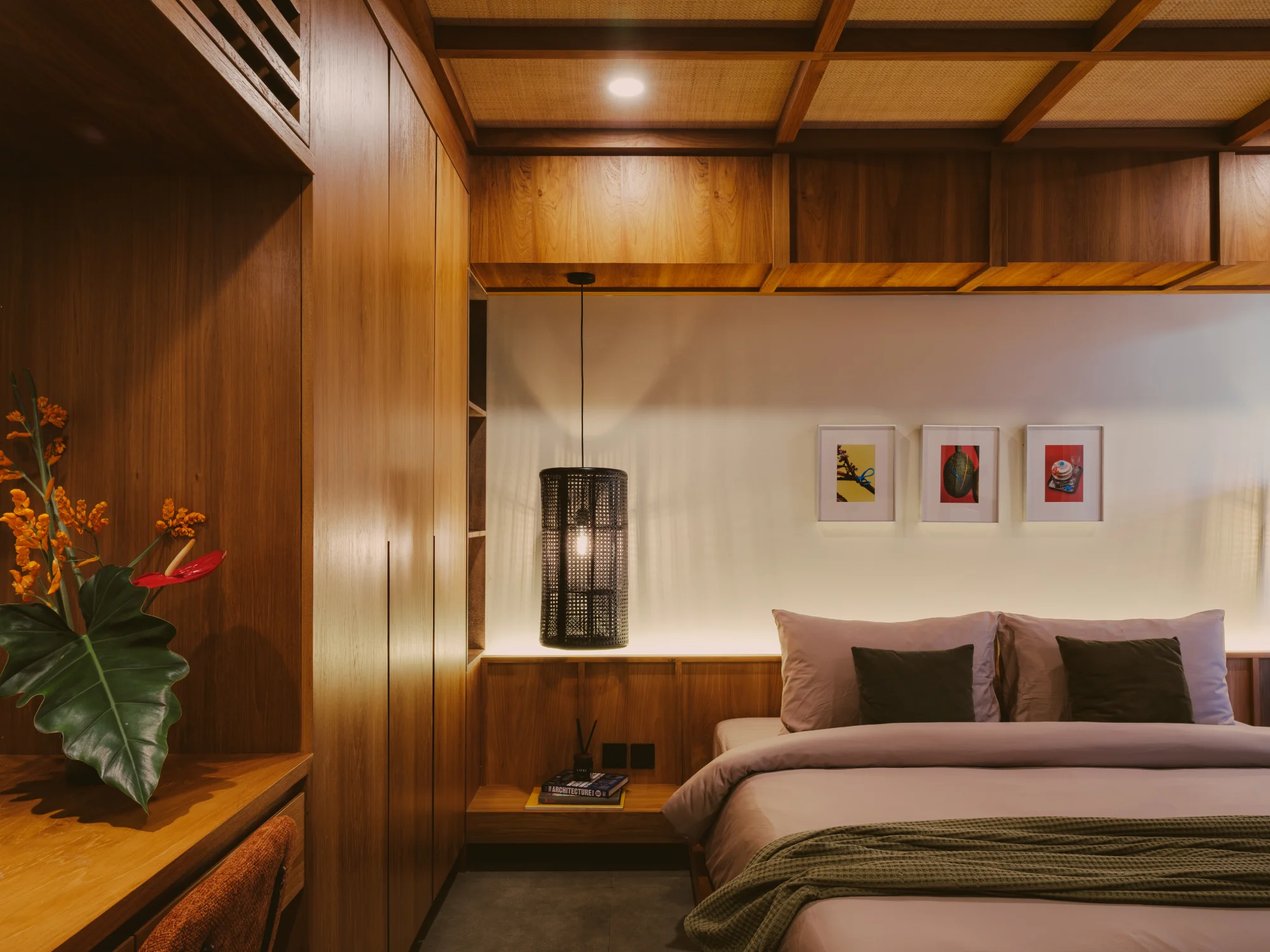 Comfortable king bed arranged with crisp linens and warm bedside lamps