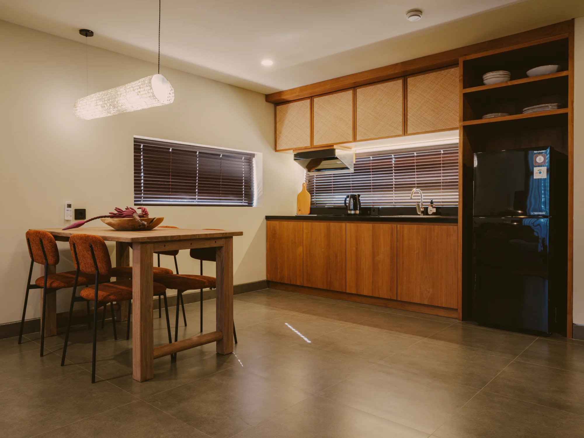 Modern kitchen counter with breakfast bar and designer lighting