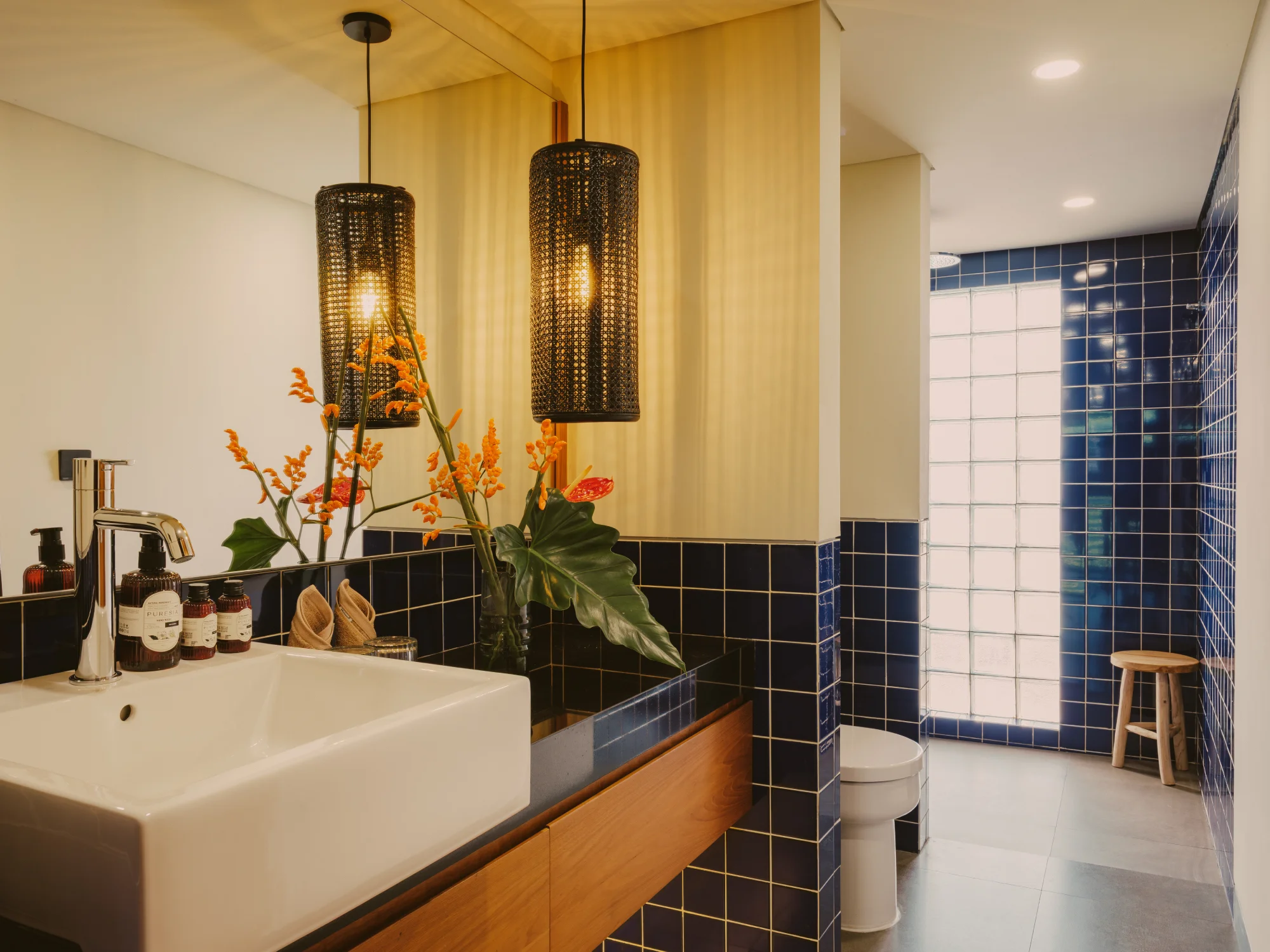 Clean minimalist bathroom with walk-in shower and large mirror