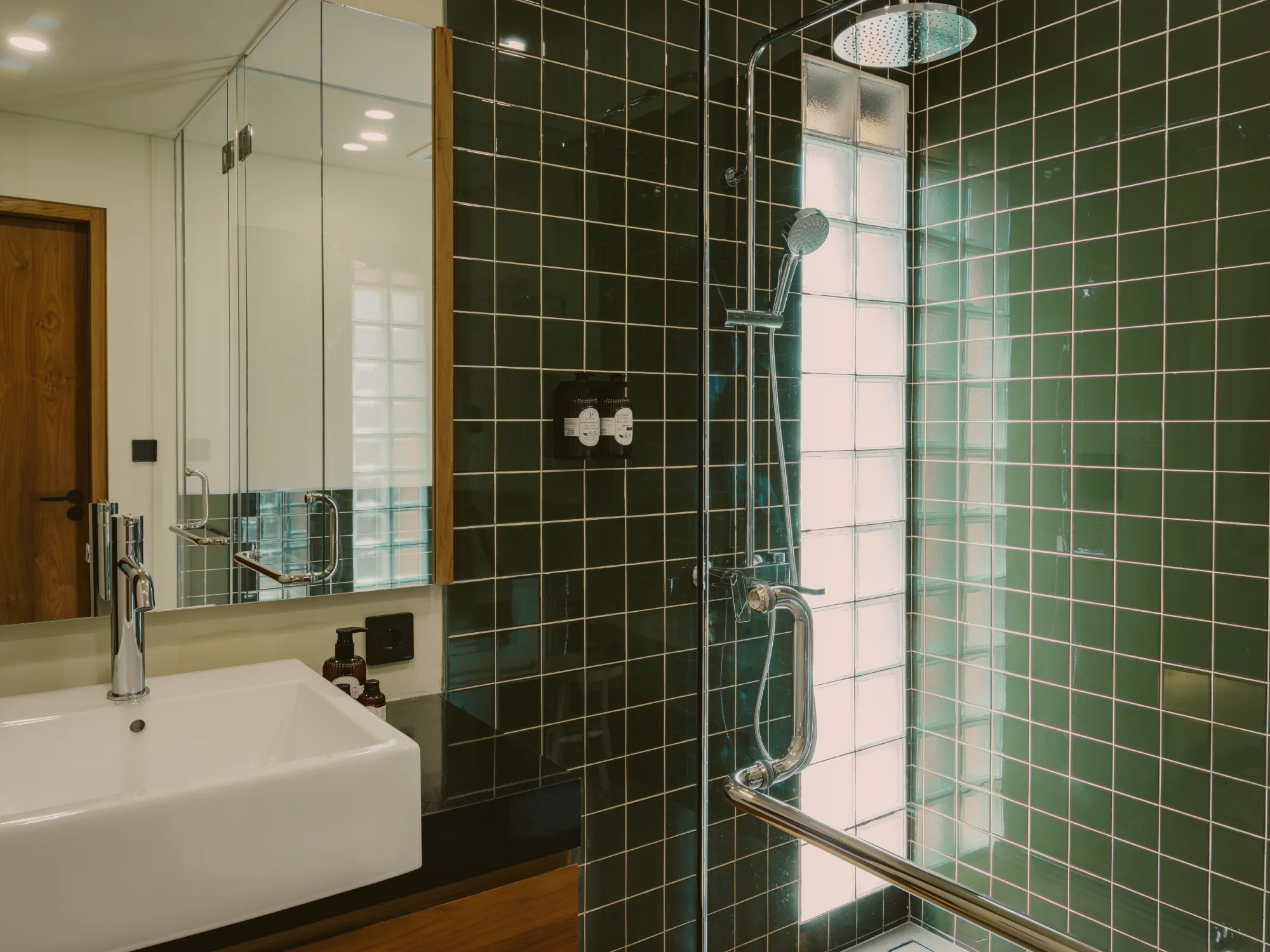 Minimalist ensuite bathroom with stone finishes and walk-in shower